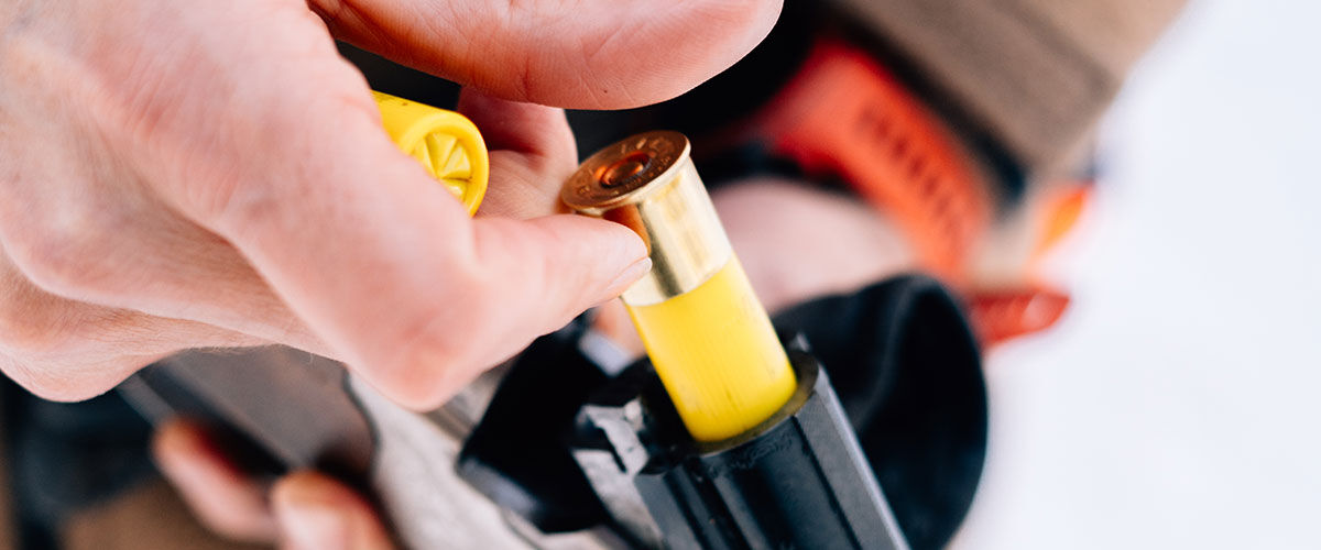 Remington Shotshell being loaded into a shotgun