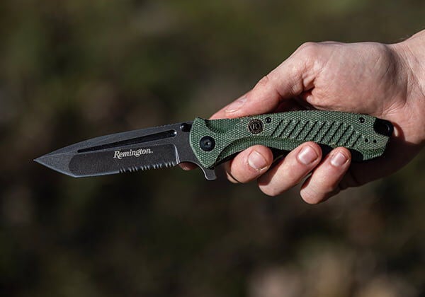 Remington knife held in a hand