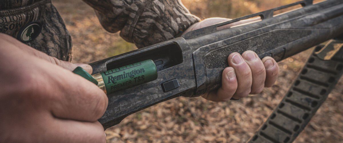 Remington Shotshell being loaded into a shotgun