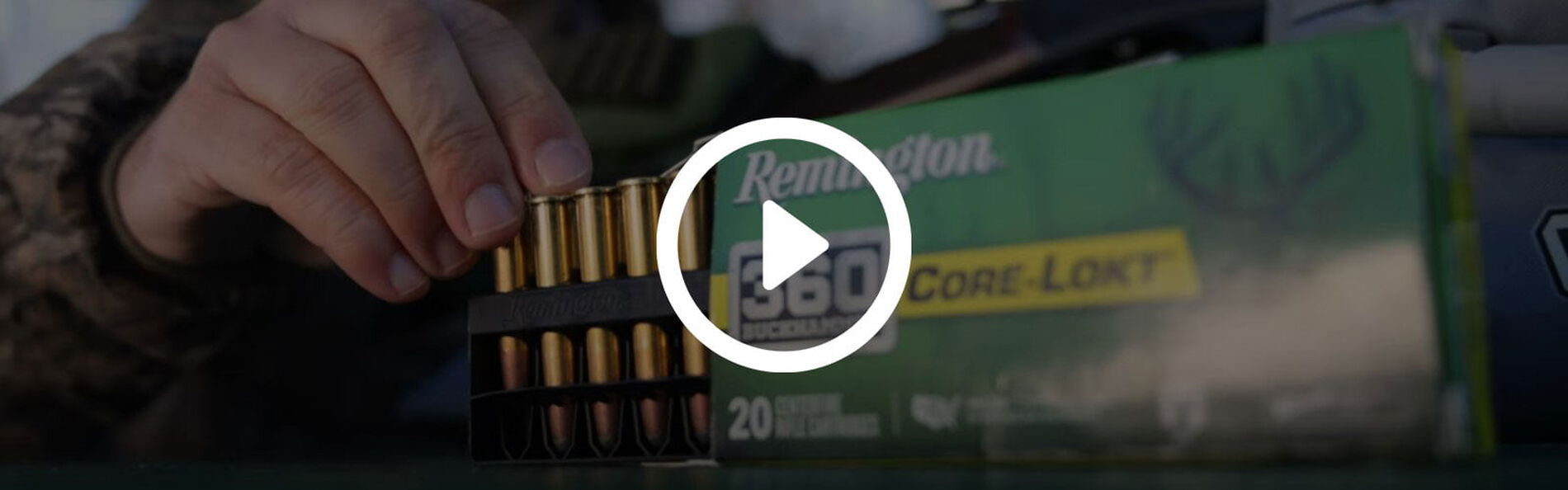 Shooter taking Core-Lokt 360 Buckhammer cartridges from packaging