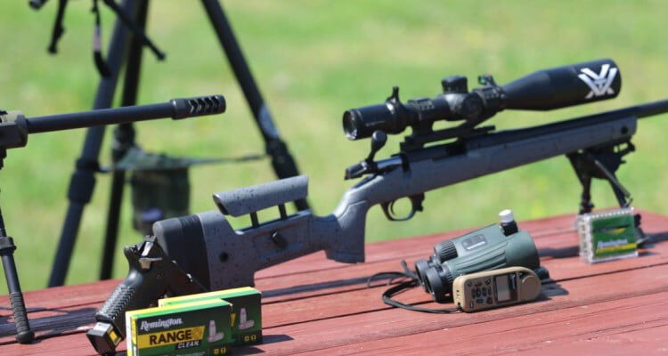 rifle on a bi-pod along Remington Range Clean boxes and binoculars