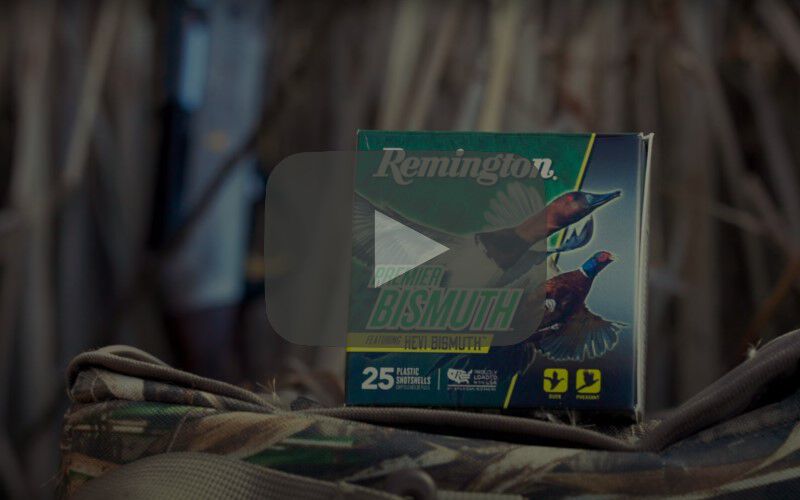 Premier Bismuth packing sitting on a game bag in front of some dried reeds