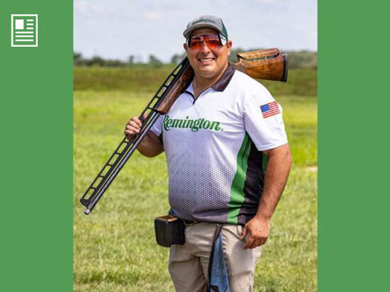 Team Remington Todd Hitch standing with a shotgun on shoulder
