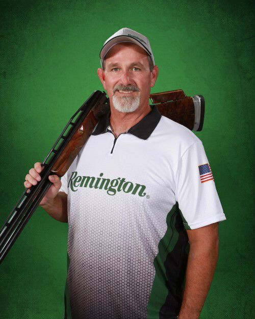team remington member with shotgun on his shoulder