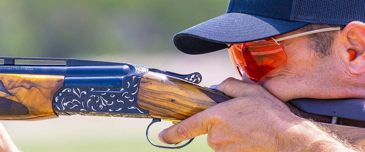 shooter looking down the sights of a shotgun
