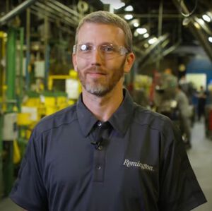 Luke Standing inside the Remington Factory