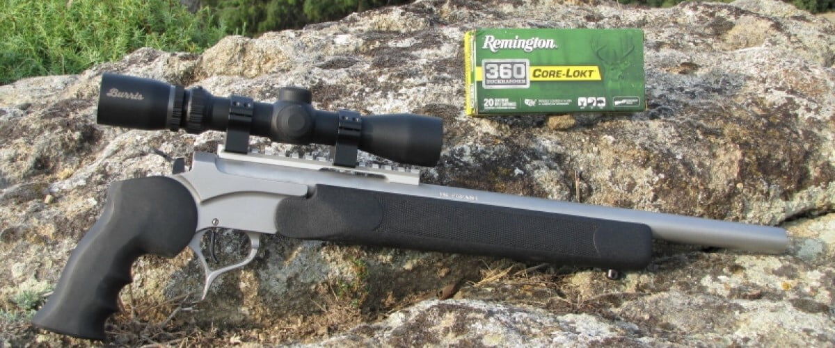 rifle laying against a rock with a box of Core-Lokt 360 Buckhammer