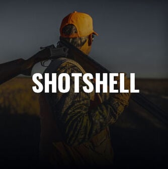 hunter with shotgun over his shoulder