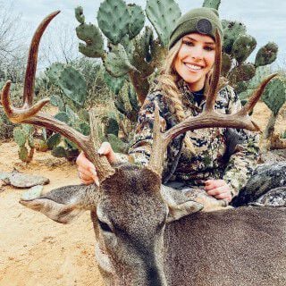 Kat in from a cactus with a deer