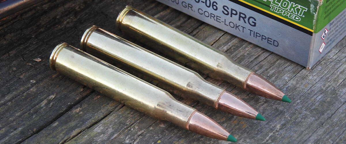 3 Core-Lokt Tipped cartridges laying on a table