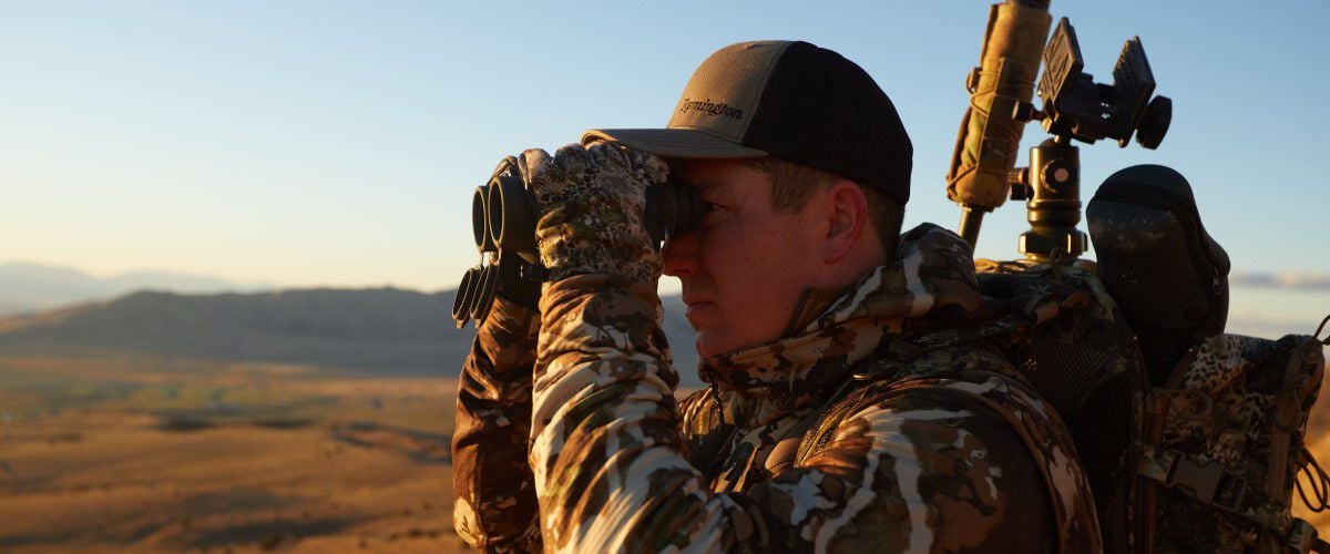 Hunter looking through binoculars