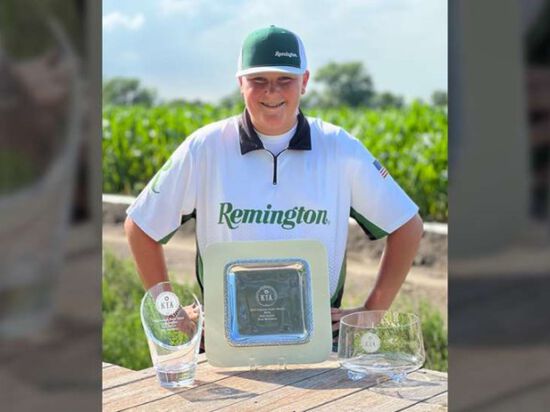 Wyatt DeBrie's standing behind his awards