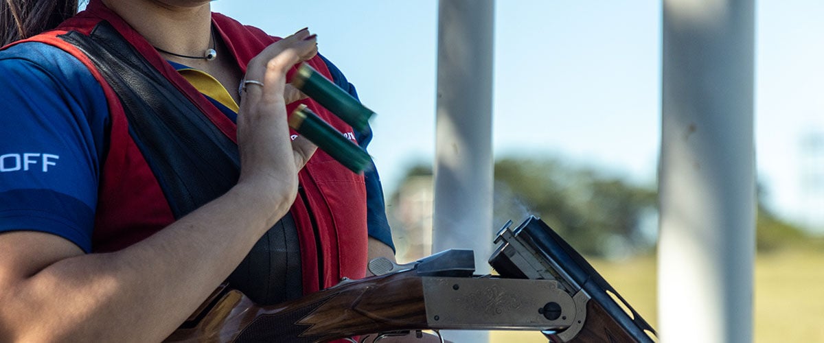 shot shotshell being ejected from a shotgun
