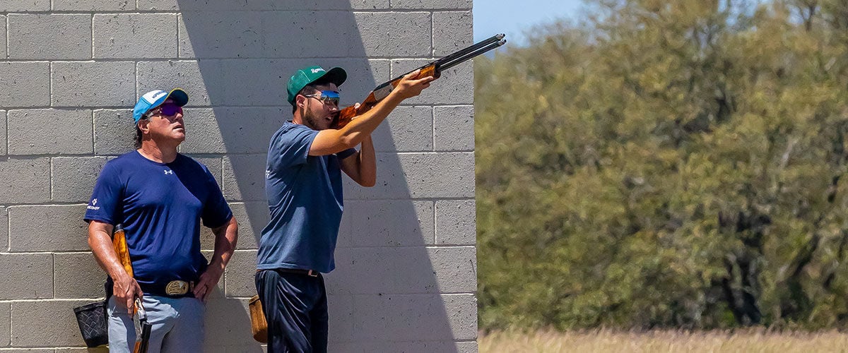 shooter aiming shotgun with another shooter waiting behind them